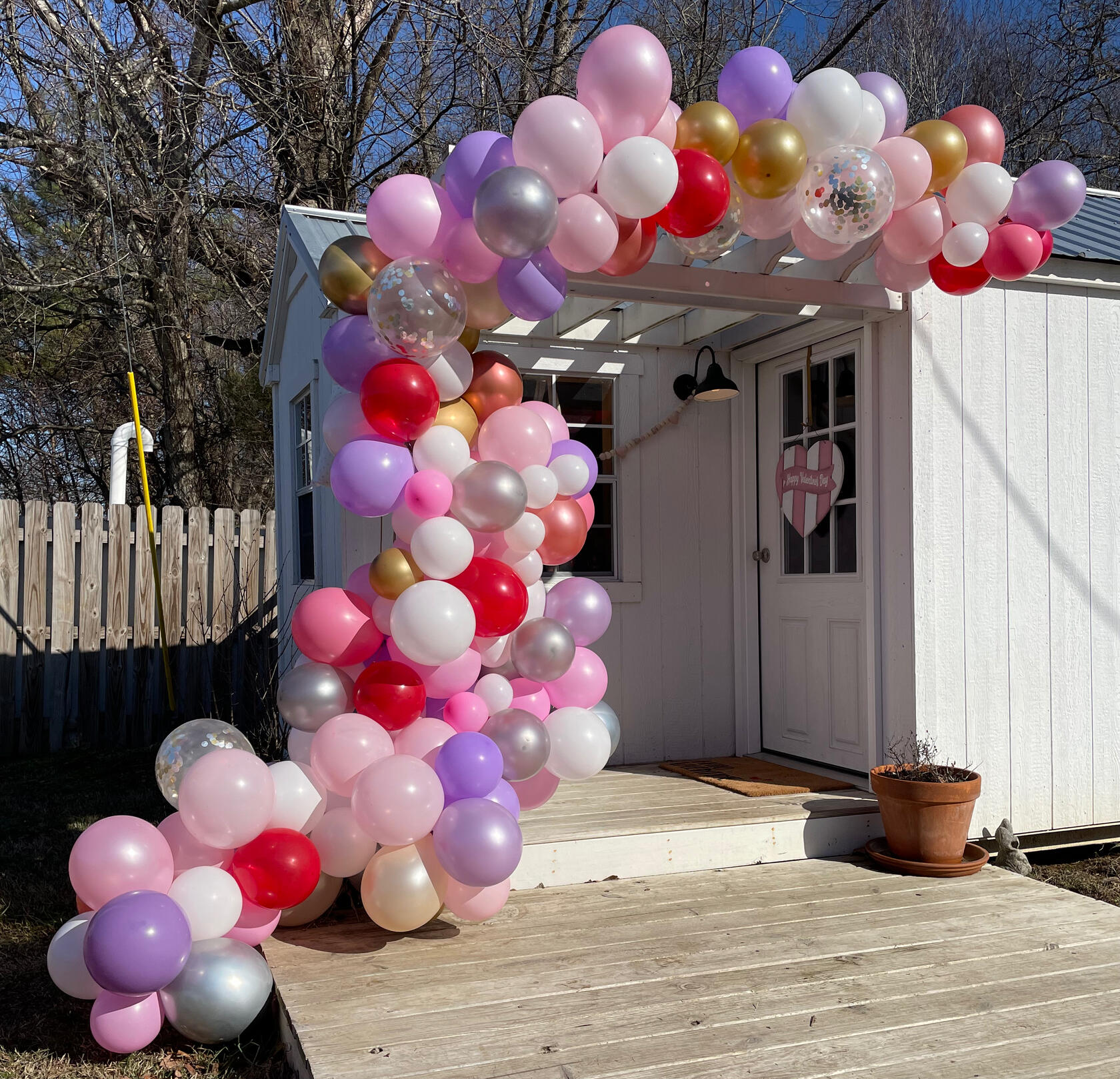 Valentines balloon garland on cottage Valentines balloon garland on cottage gift shop